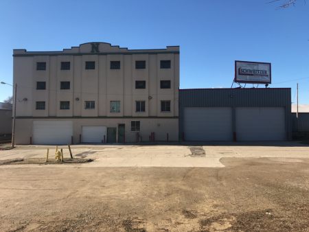 Before photo shows Schweitzer's "Future Home" sign